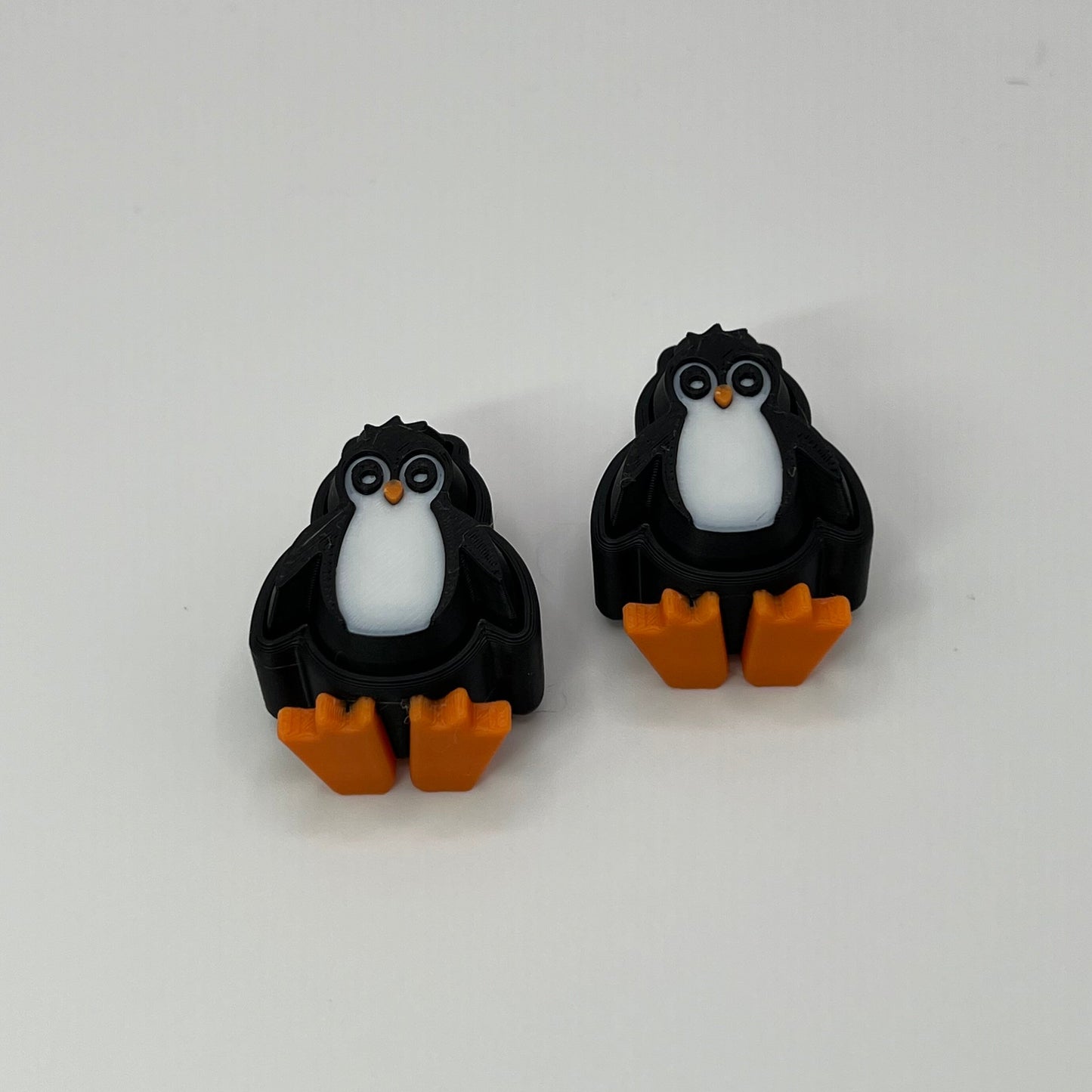 Penguin Clickers Arms Down