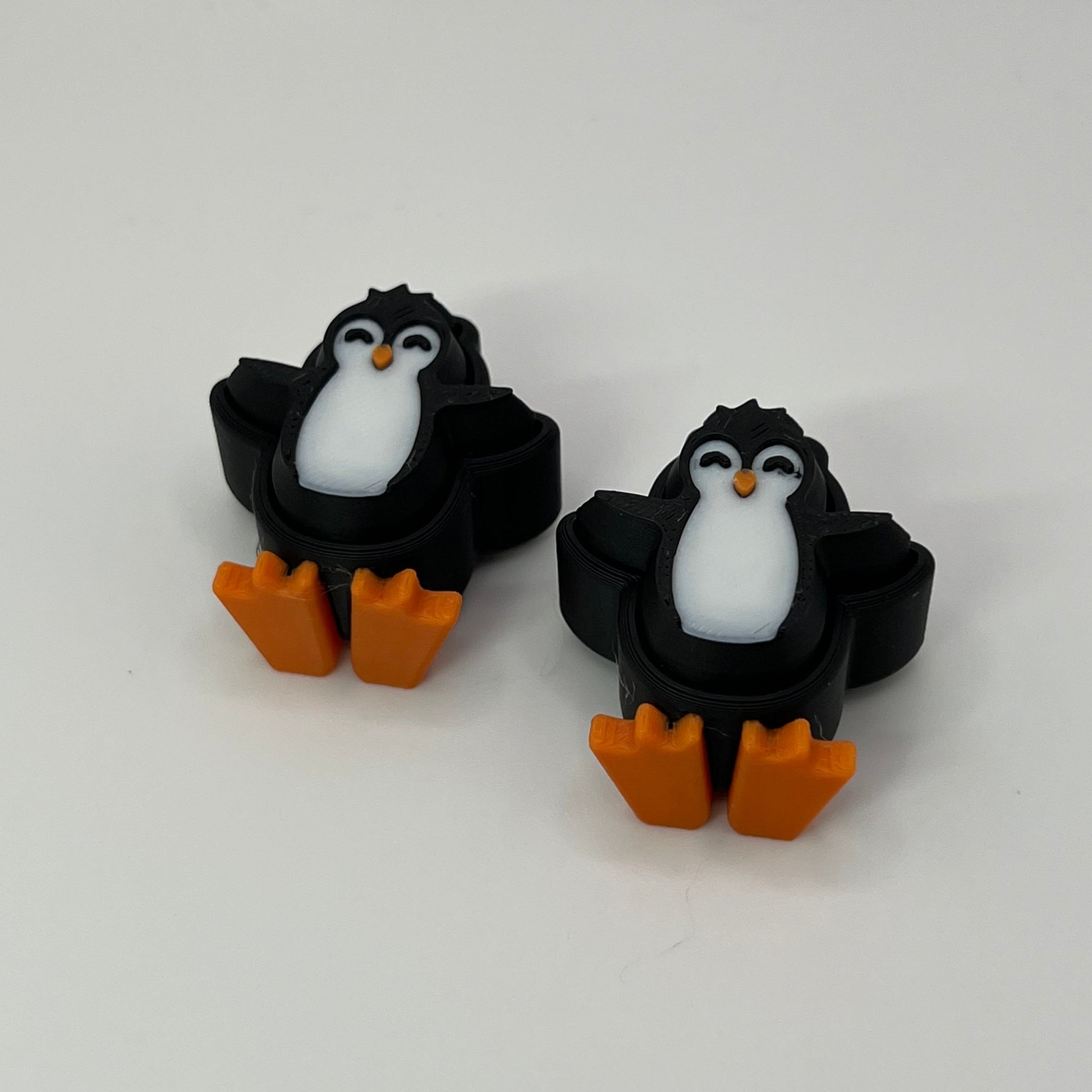 Penguin Clickers Arms Up